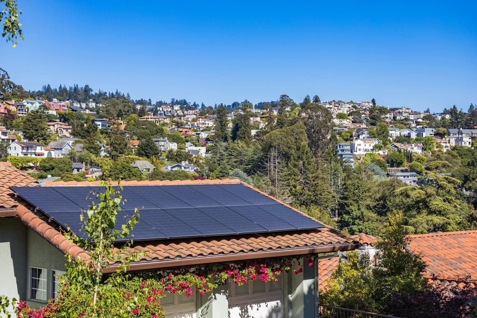 A Florida home with rooftop solar panels overlooking a neighborhood