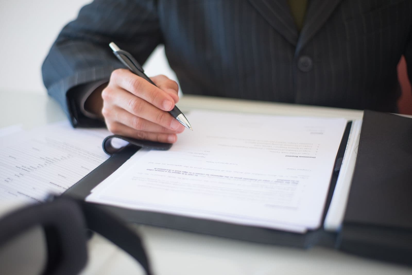 Homeowner signing a solar financing contract on a tablet during a high-pressure sales visit